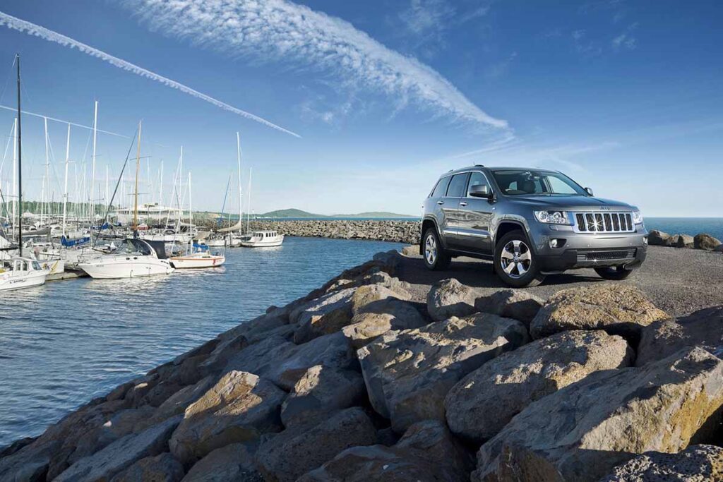 Jeep Grand Cherokee Next to Rocks and Water