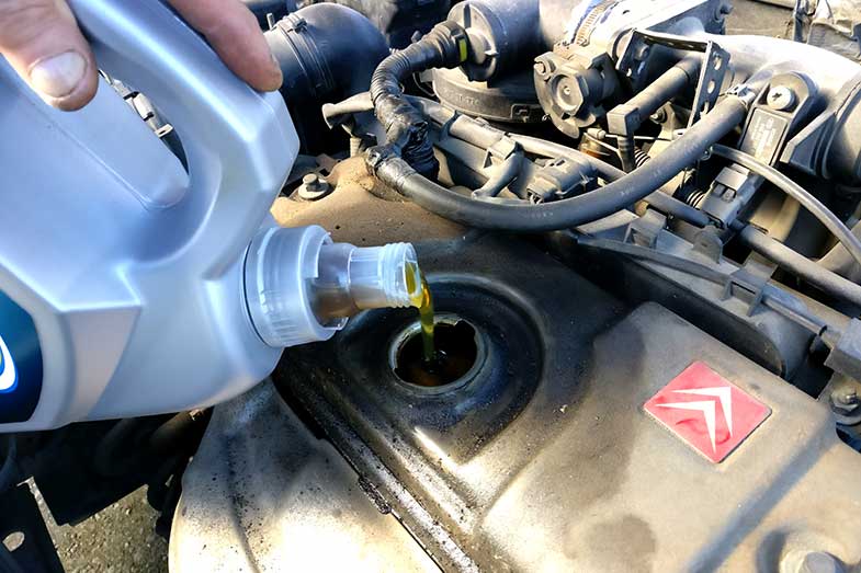 Pouring Engine Oil