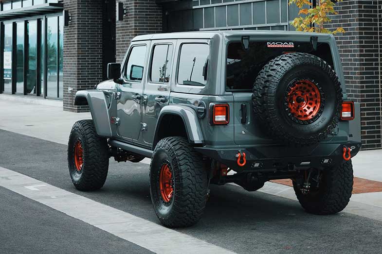 Gray Jeep Wrangler SUV Parked Near Building