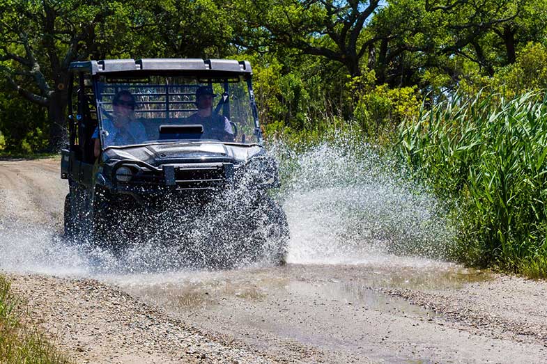 ATV Driving Through Water Splash