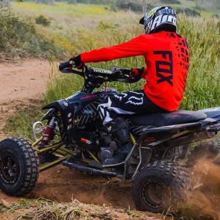 Man in Red and Black Riding ATV