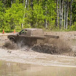 Off-Road Truck Driving Through Mud Bog