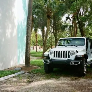 White and Black Jeep Wrangler Parked