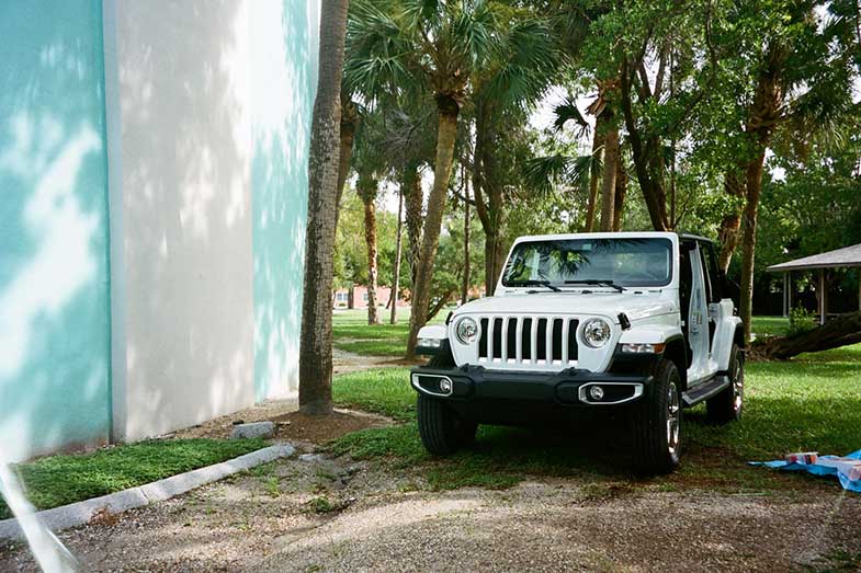 White and Black Jeep Wrangler Parked