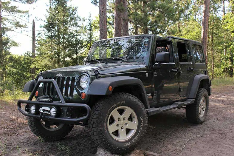 2011 Jeep Wrangler Propped on Wood Stacks in Michigan