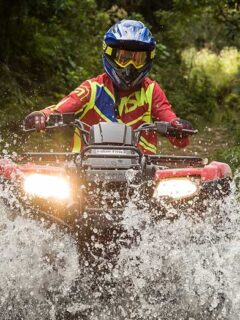 ATV Rider Splashing Through Water