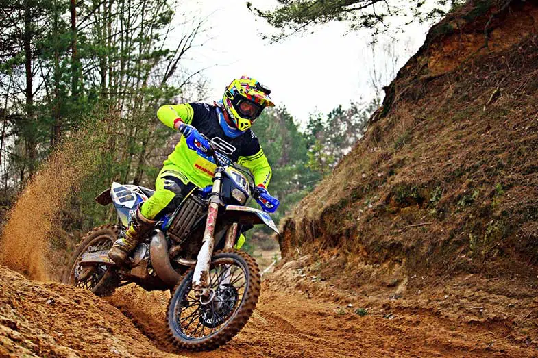 Dirt Bike Rider Turning Corner on a Track