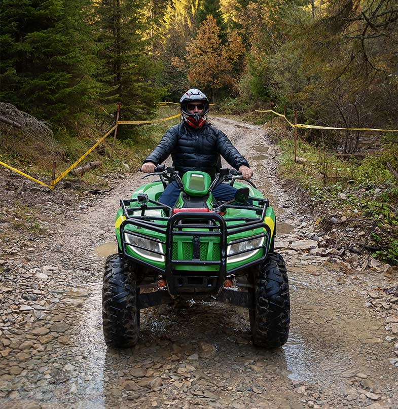Green Quad Bike in the Mountains