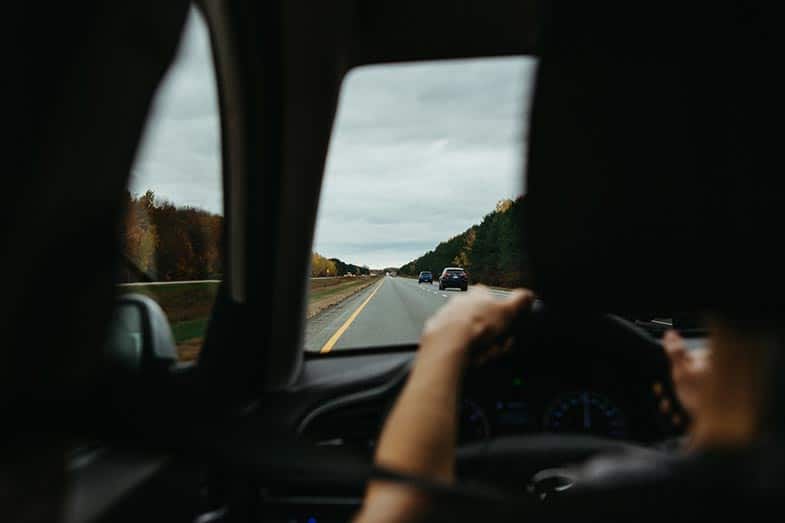 Person Driving a Vehicle on the Highway