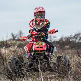 ATV Rider with Arms Crossed on Trail