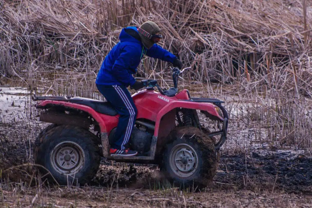 Red Yamaha ATV Quad in the Mud