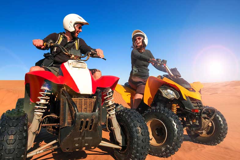 Happy People Riding ATV Quad Bikes