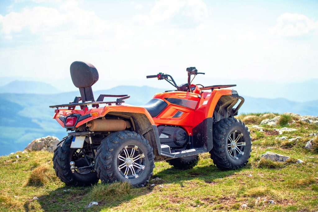 Red ATV Quad Bike Parked on a Hill