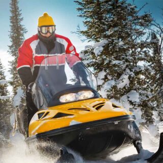 Yellow Snowmobile on Trail