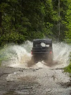 Off-Roading UTV Splashing Through Water