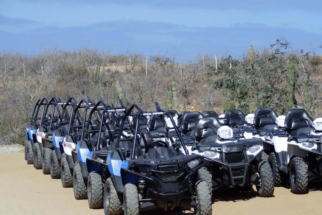 Several ATVs Parked on Sand