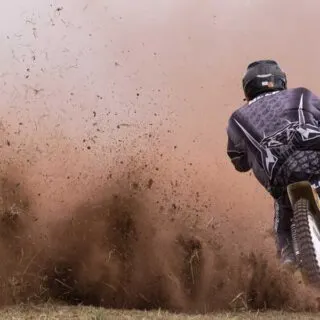Person Driving Motocross Dirt Bike