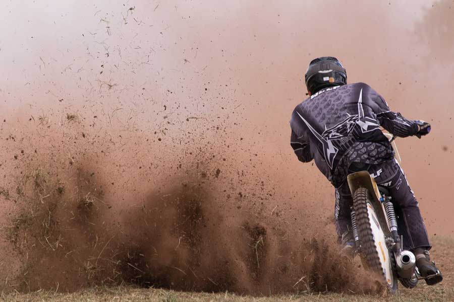 Person Driving Motocross Dirt Bike