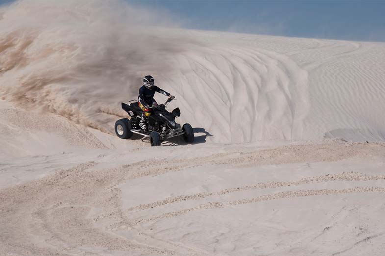 Quad Bike Racing Down Sand Dune