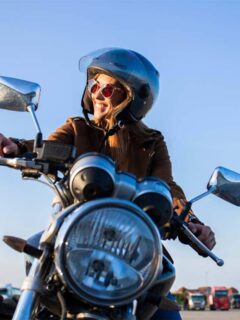 Female Motorbike Rider Wearing Helmet