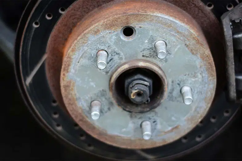 Rusty Brake Rotor on Wheel with Brake Caliper