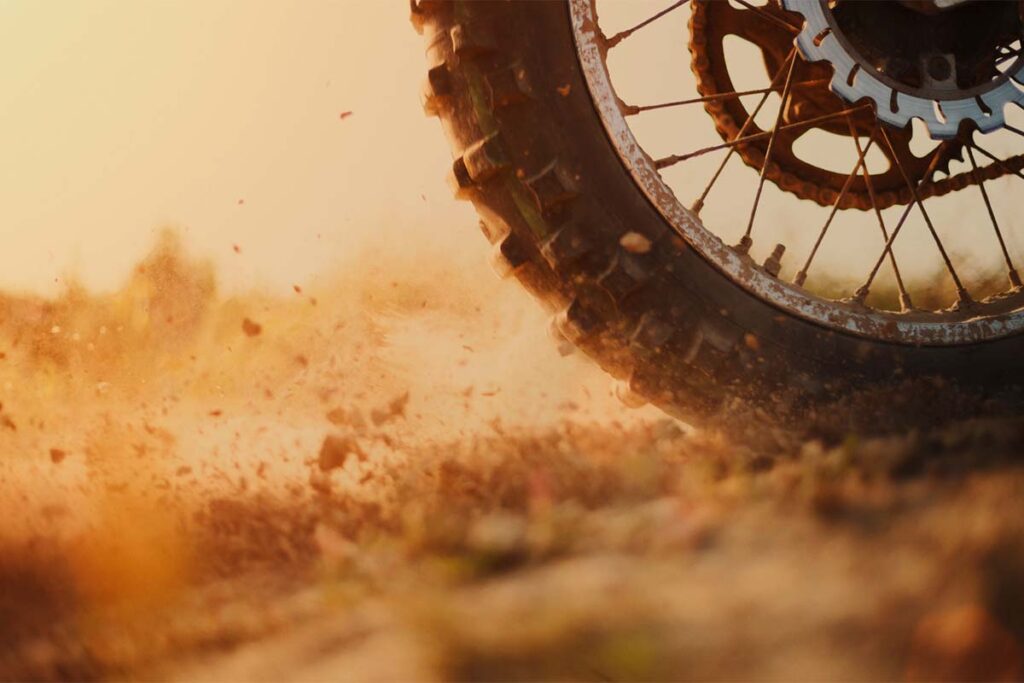Motocross Bike Rear Wheel Kicking Up Dirt