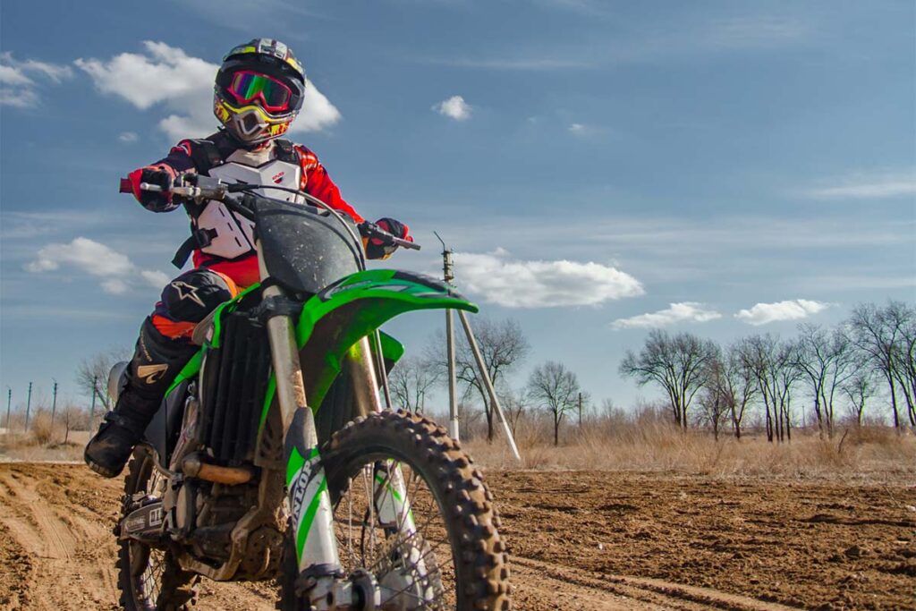 Green Kawasaki Dirt Bike on Track