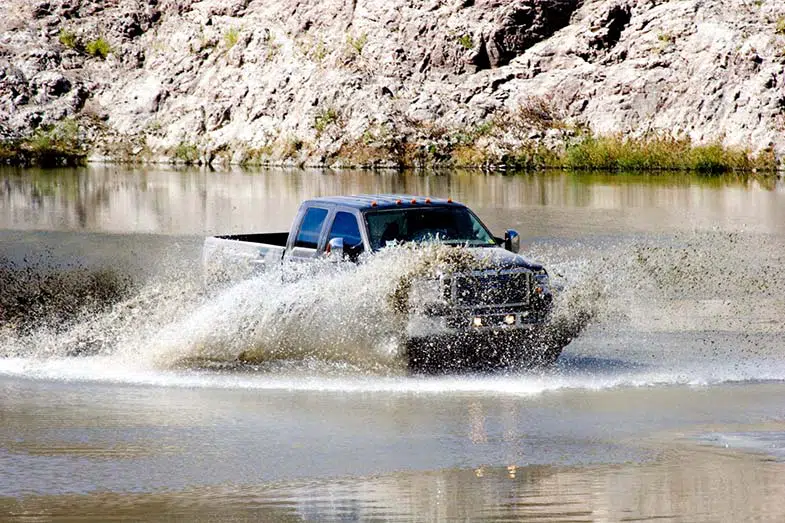 Truck Driving Through Water Off-Road