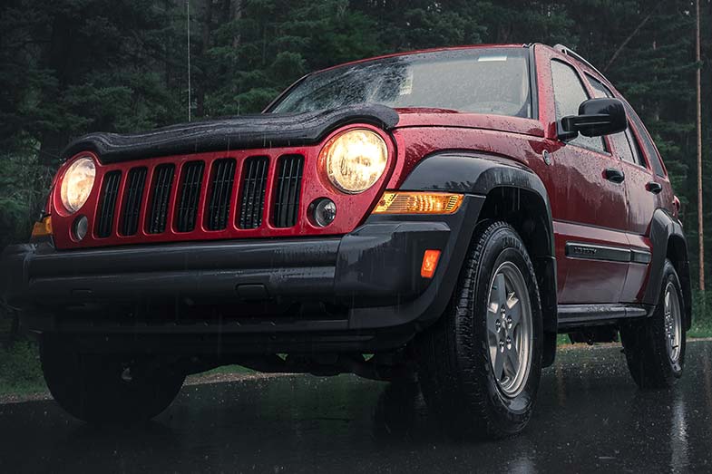 Red Jeep on a Rainy Day at Night