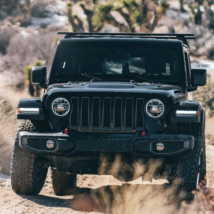 Black Jeep Rubicon Off-Roading Uphill