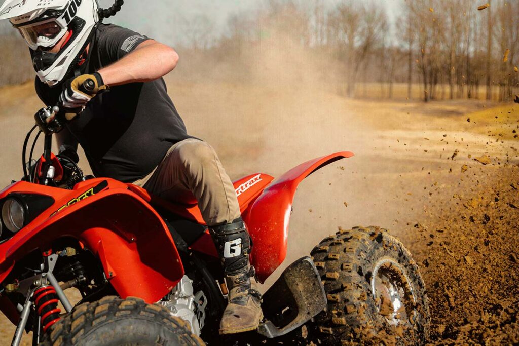 Red Honda Sportrax ATV on a Dirt Track