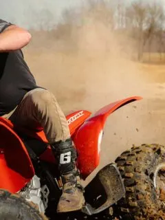 Red Honda Sportrax ATV on a Dirt Track