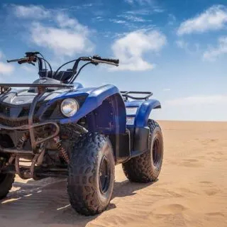 Blue ATV on Desert Sand