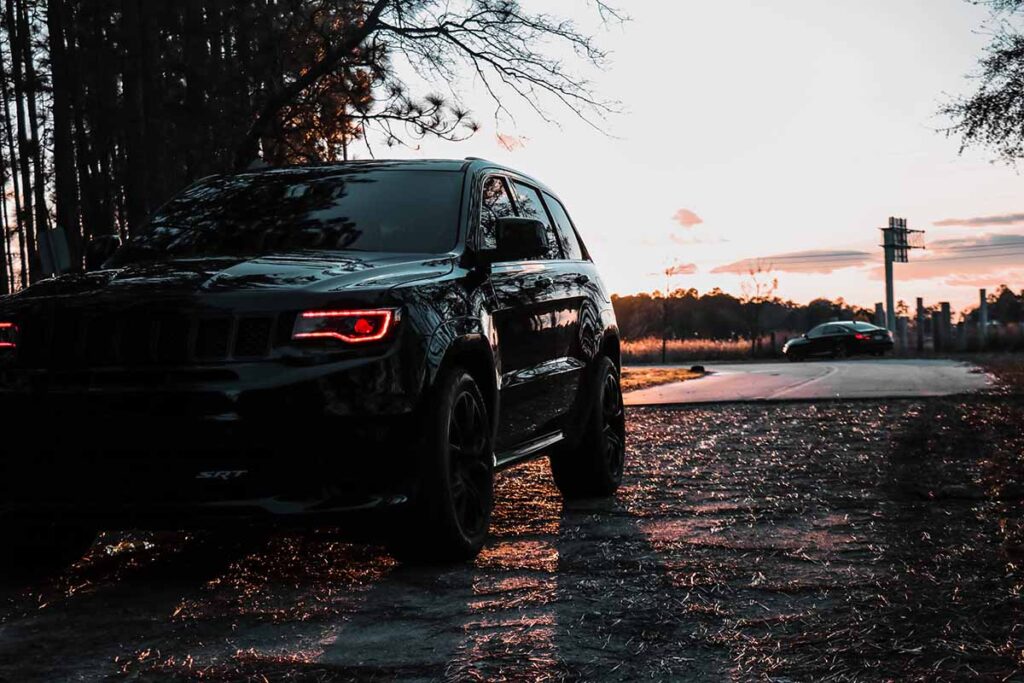 Black SUV Parked With Lights On