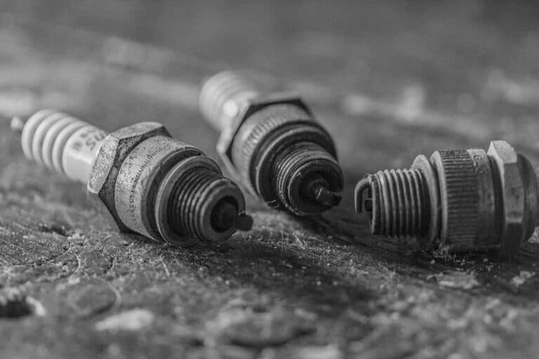 10 Bad Spark Plug Symptoms & Replacement Cost