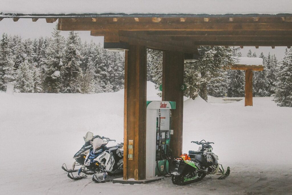 Snowmobiles at the Gas Pump in Montana