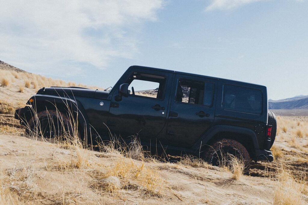 Black Jeep Parked on a Hill