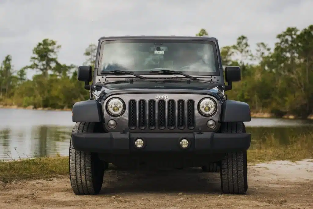 Black Jeep Wrangler Parked by Lake