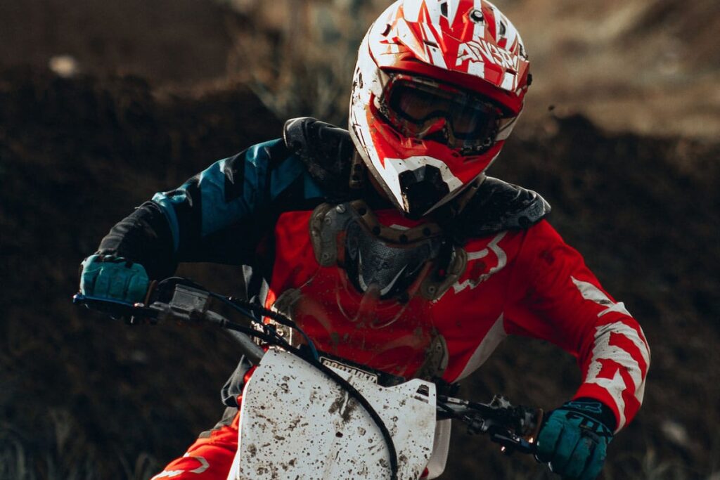 Person With Red Helmet Riding Motocross Bike