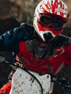 Person With Red Helmet Riding Motocross Bike
