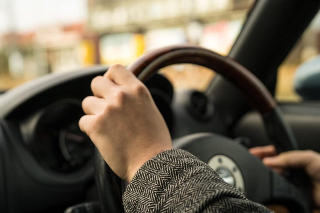 Hands on Car Steering Wheel