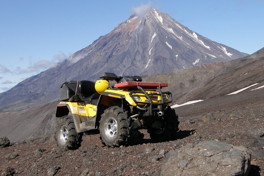 Yellow ATV in Front of Volcano