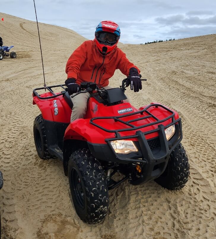 Riding Red ATV in the Oregon Dunes
