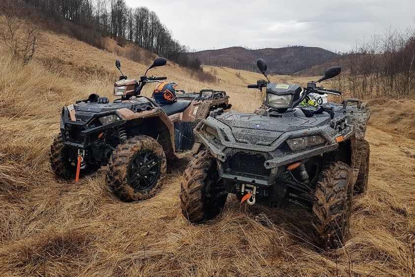 Two Polaris ATVs Parked Beside Each Other