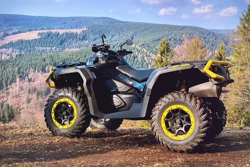 Yellow and Black ATV on Brown Field
