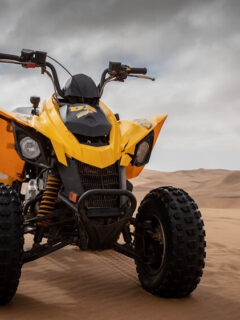 Yellow and Black Can-Am DS 250 ATV on Sand