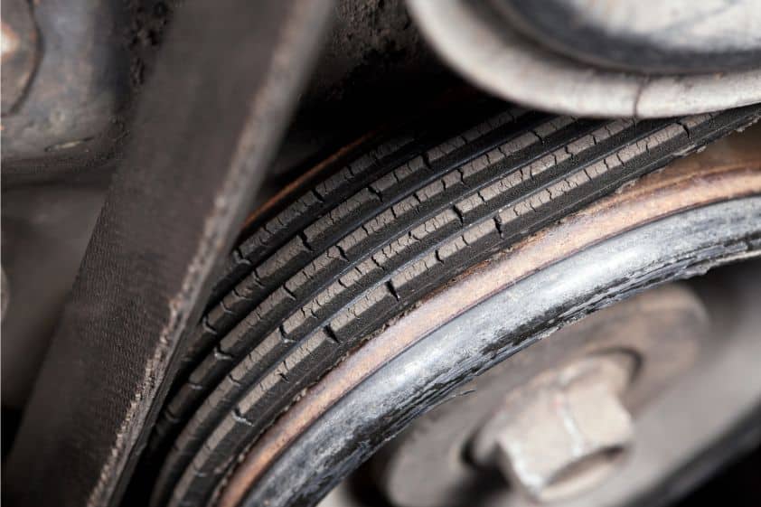 Cracked Serpentine Belt on Vehicle Engine Pulley