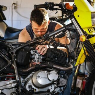 Man Fixing Dirt Bike Carburetor