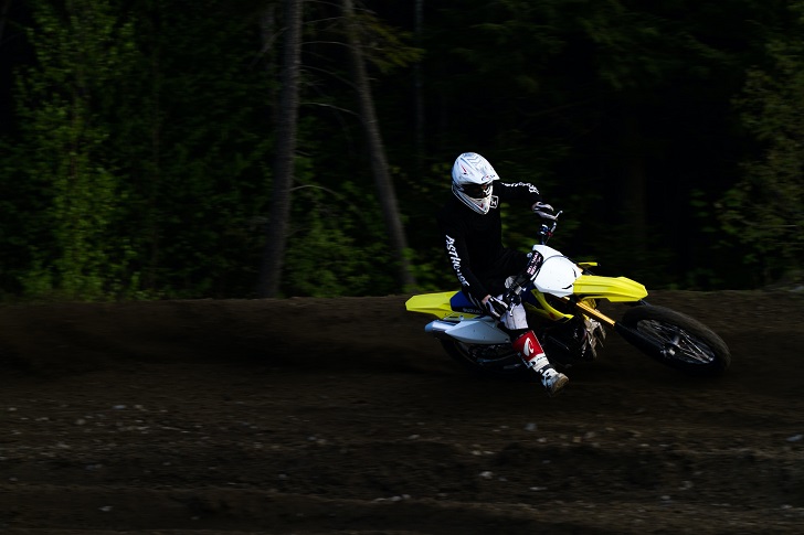 Man Riding Yellow and White Dirt Bike