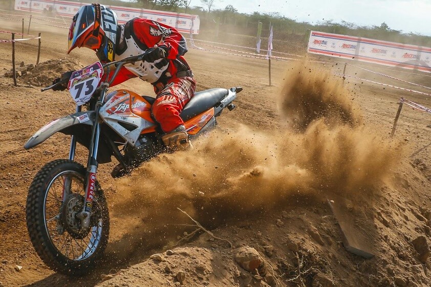 Motocross Dirt Bike Rider on Dusty Track